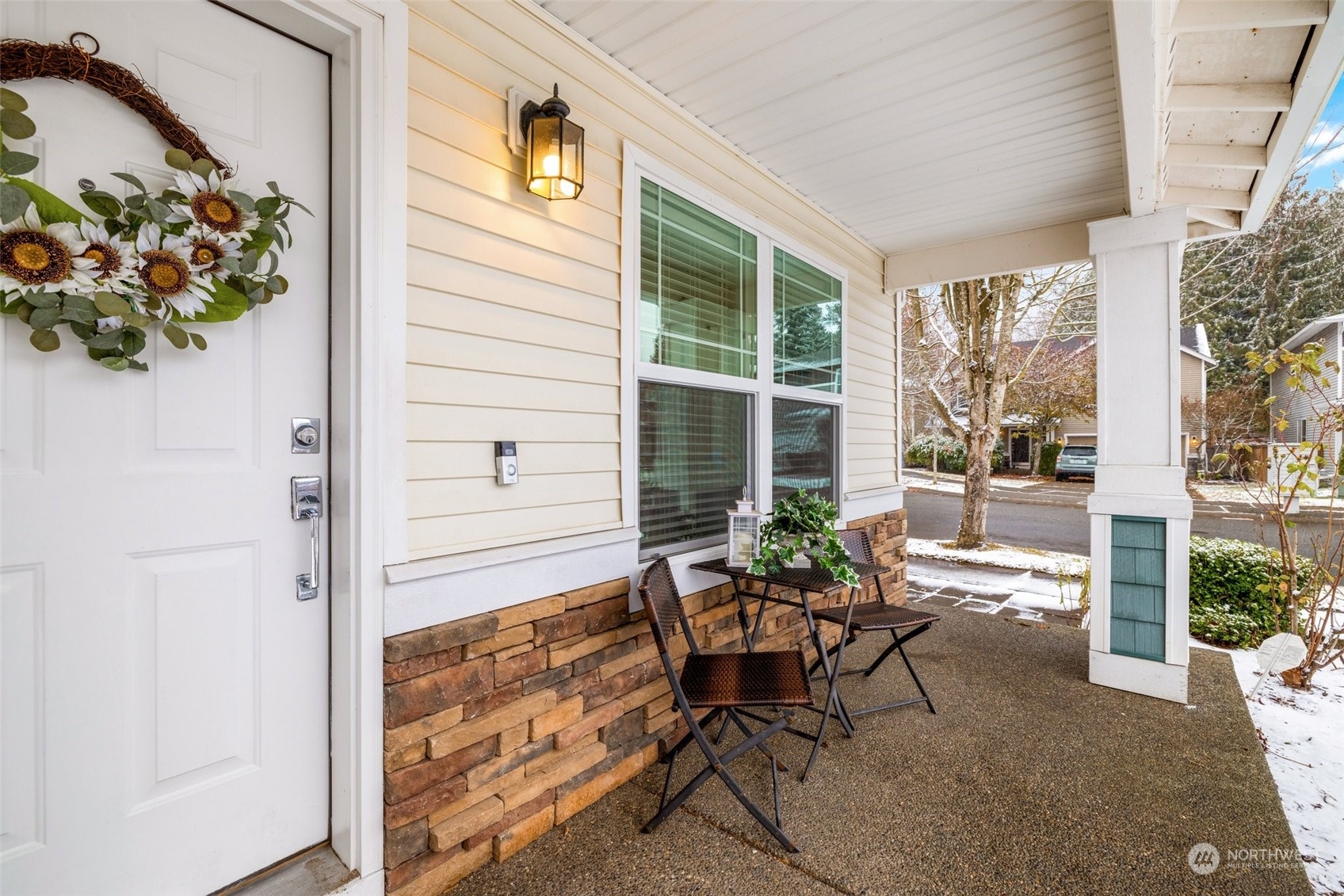 3500 154th Place Southeast Bothell, WA 98012 - Photo 4 of 36 a view of a porch with chairs and potted plants