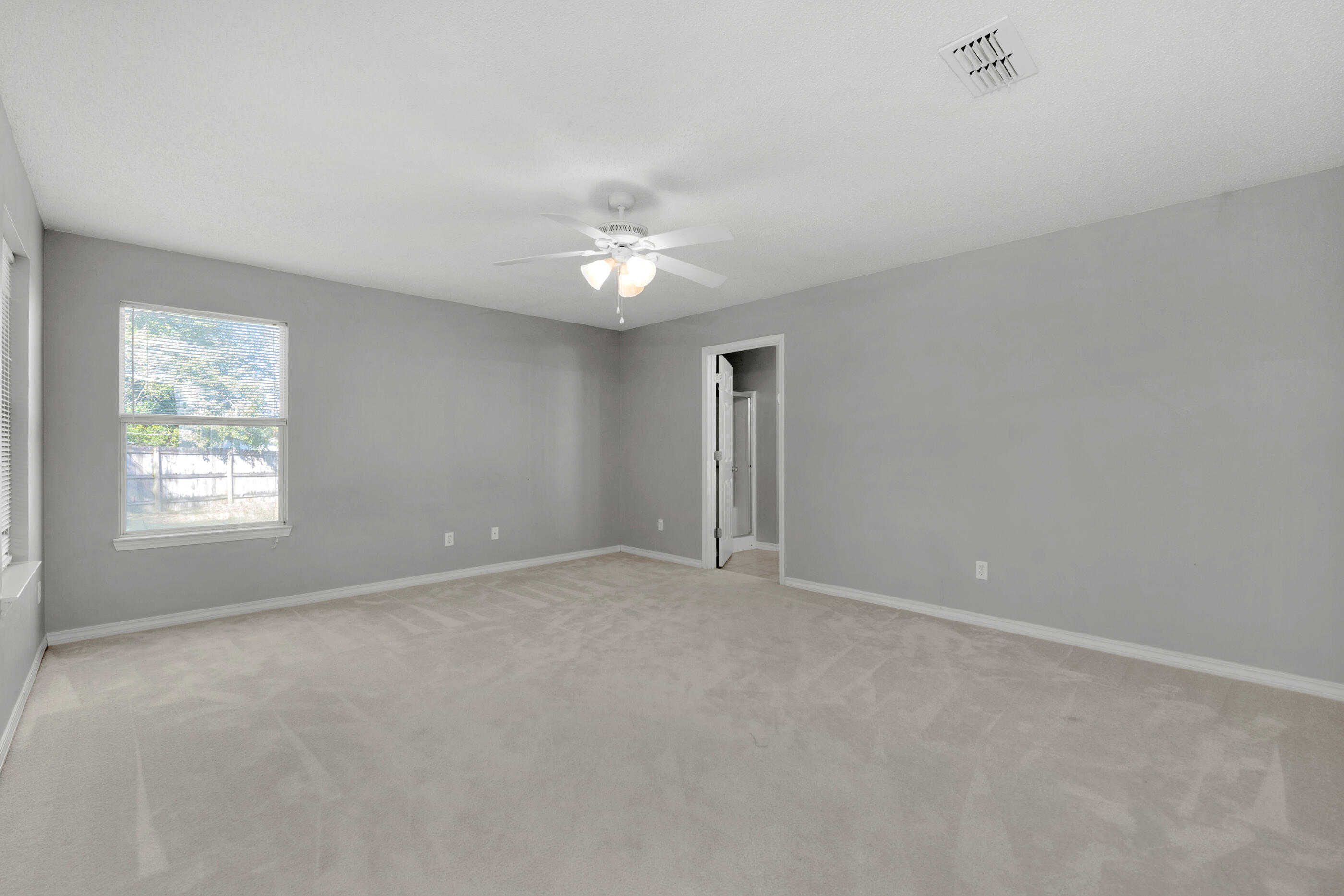 110 Sandstone Trail Crestview, FL 32539 - Photo 12 of 25 a view of an empty room with a window