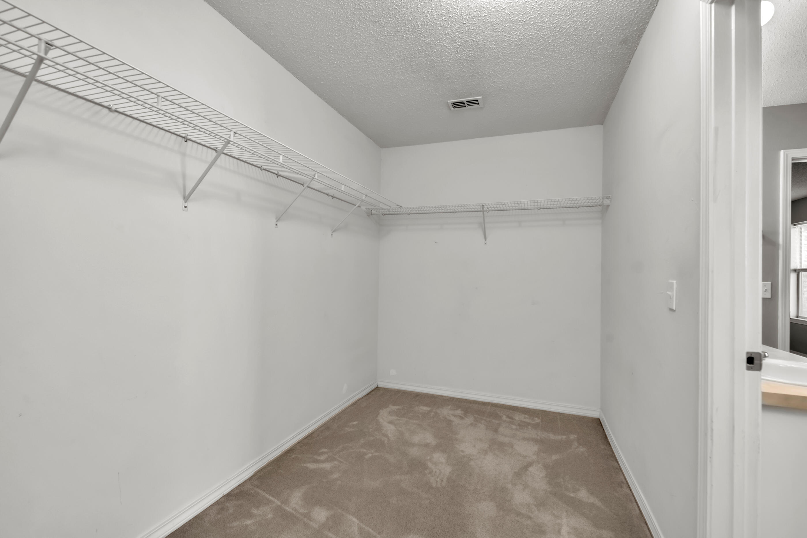 110 Sandstone Trail Crestview, FL 32539 - Photo 17 of 25 a view of a room with racks on the wall