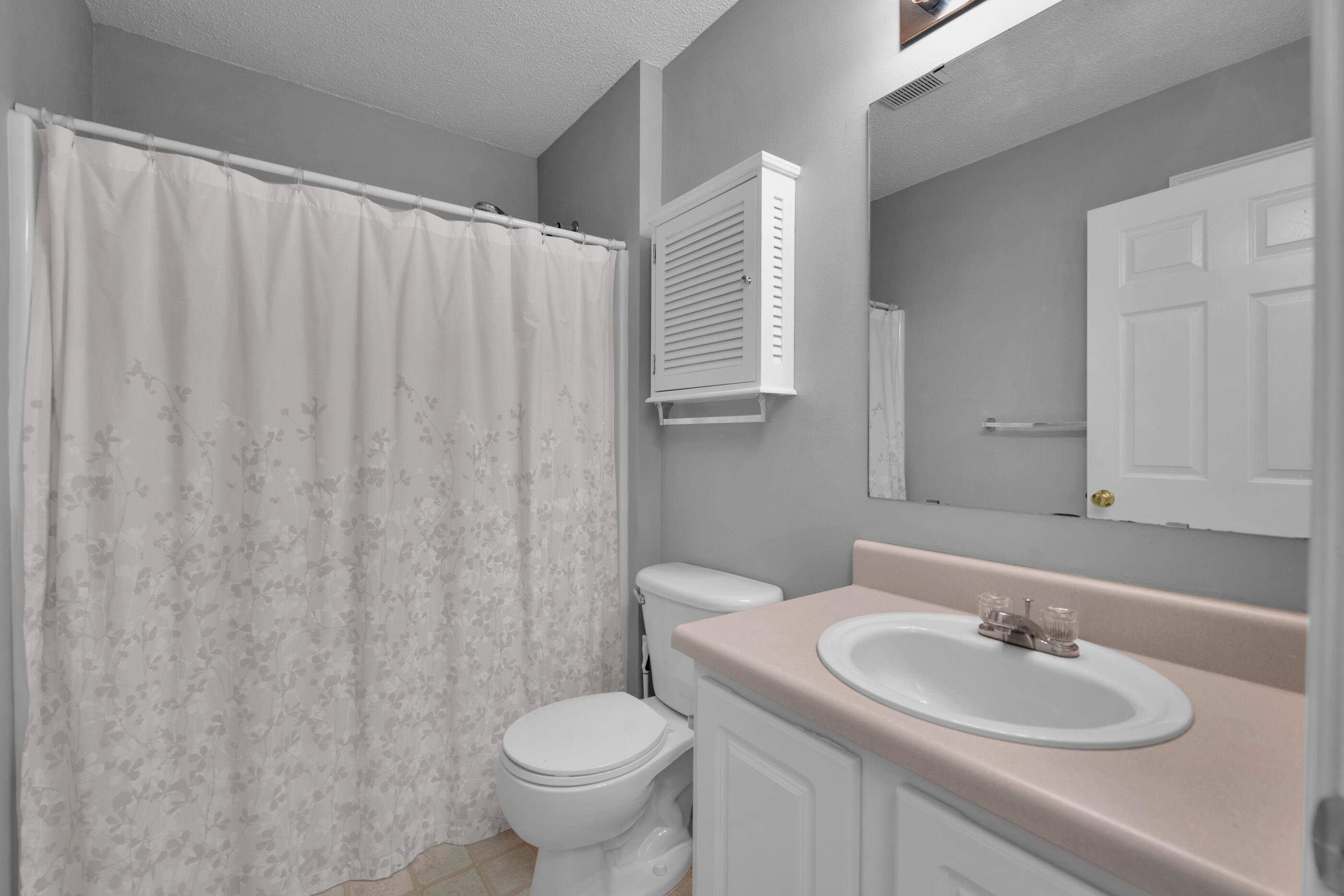 110 Sandstone Trail Crestview, FL 32539 - Photo 18 of 25 a bathroom with a sink and a mirror
