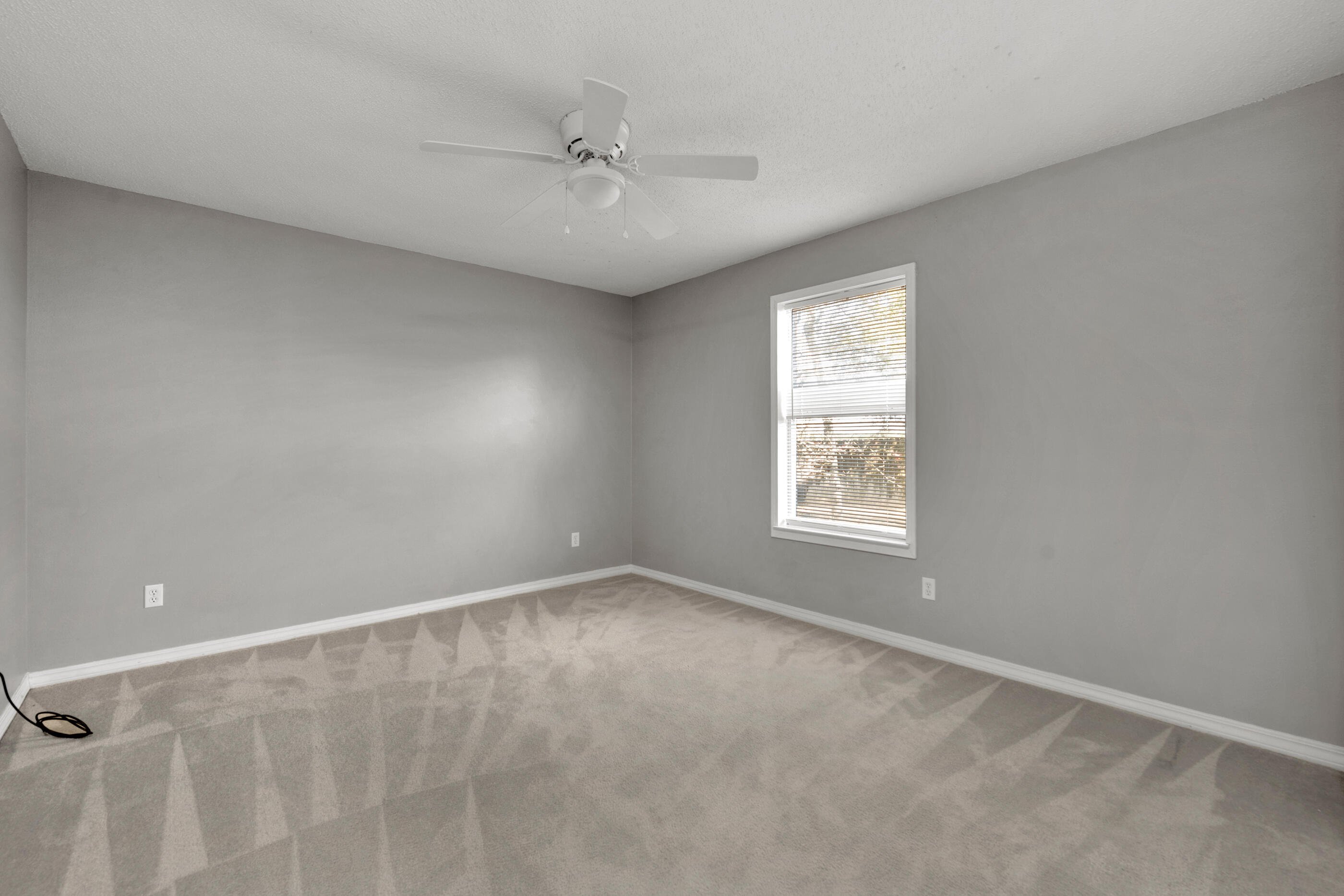 110 Sandstone Trail Crestview, FL 32539 - Photo 19 of 25 a view of an empty room with a window