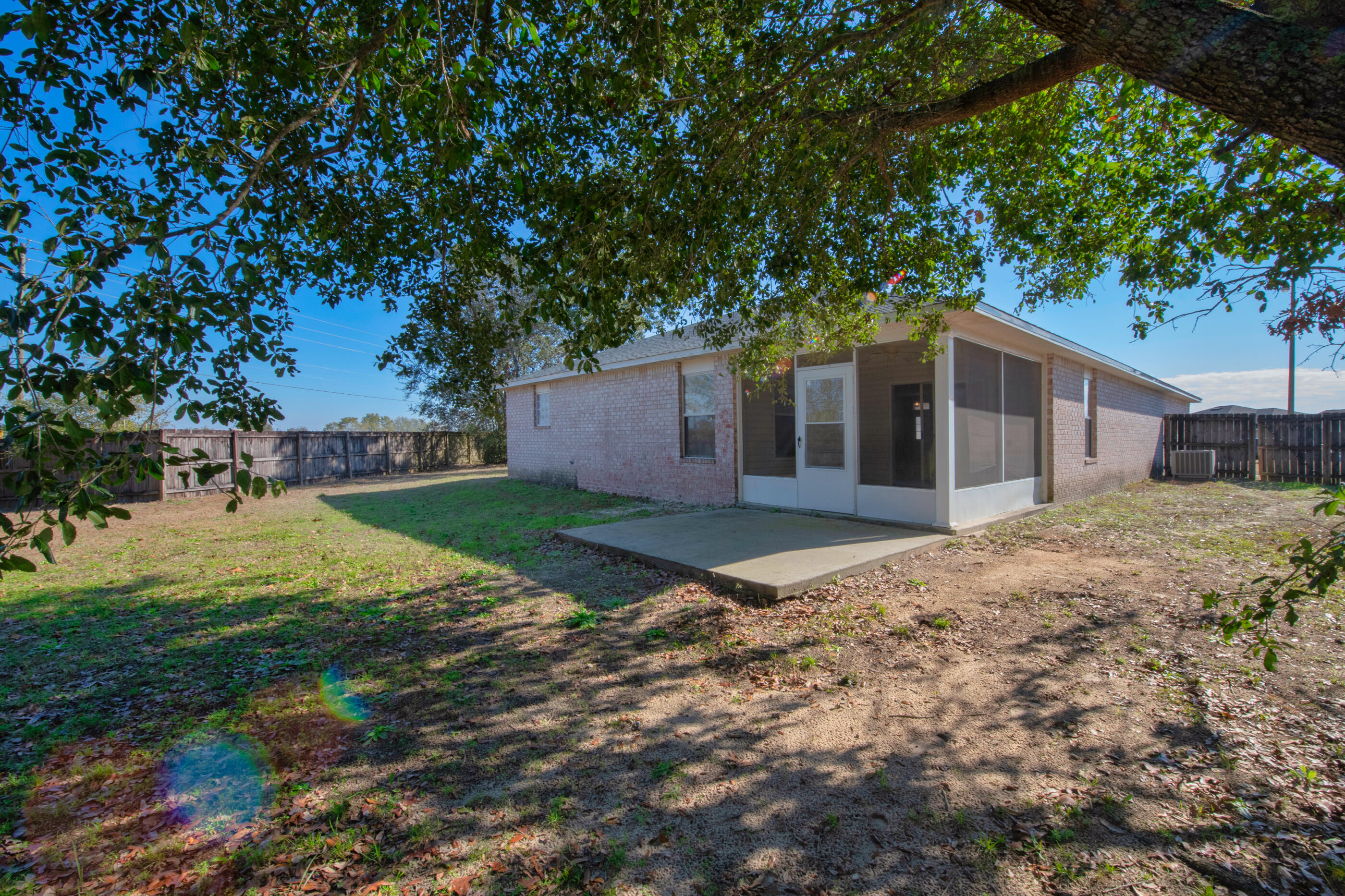 110 Sandstone Trail Crestview, FL 32539 - Photo 23 of 25 a front view of house with yard and trees