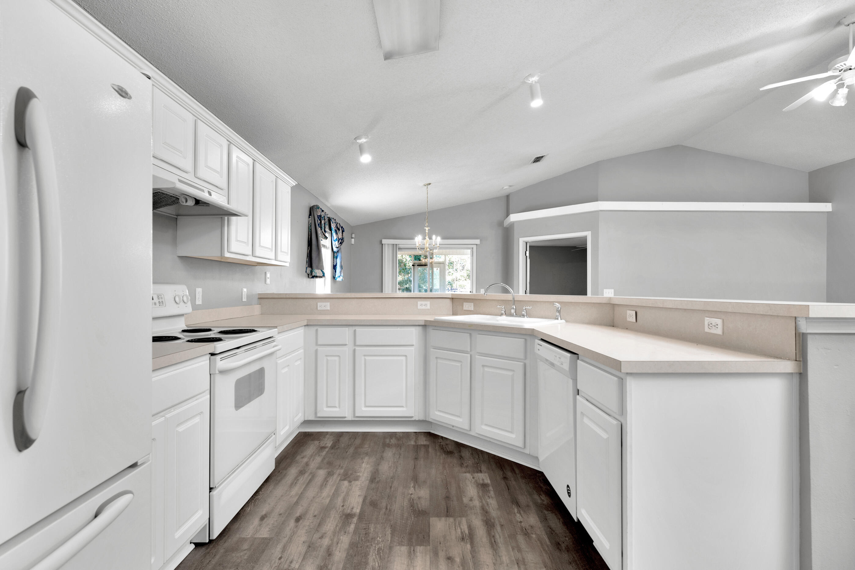 110 Sandstone Trail Crestview, FL 32539 - Photo 7 of 25 a kitchen with granite countertop a sink stainless steel appliances and white cabinets