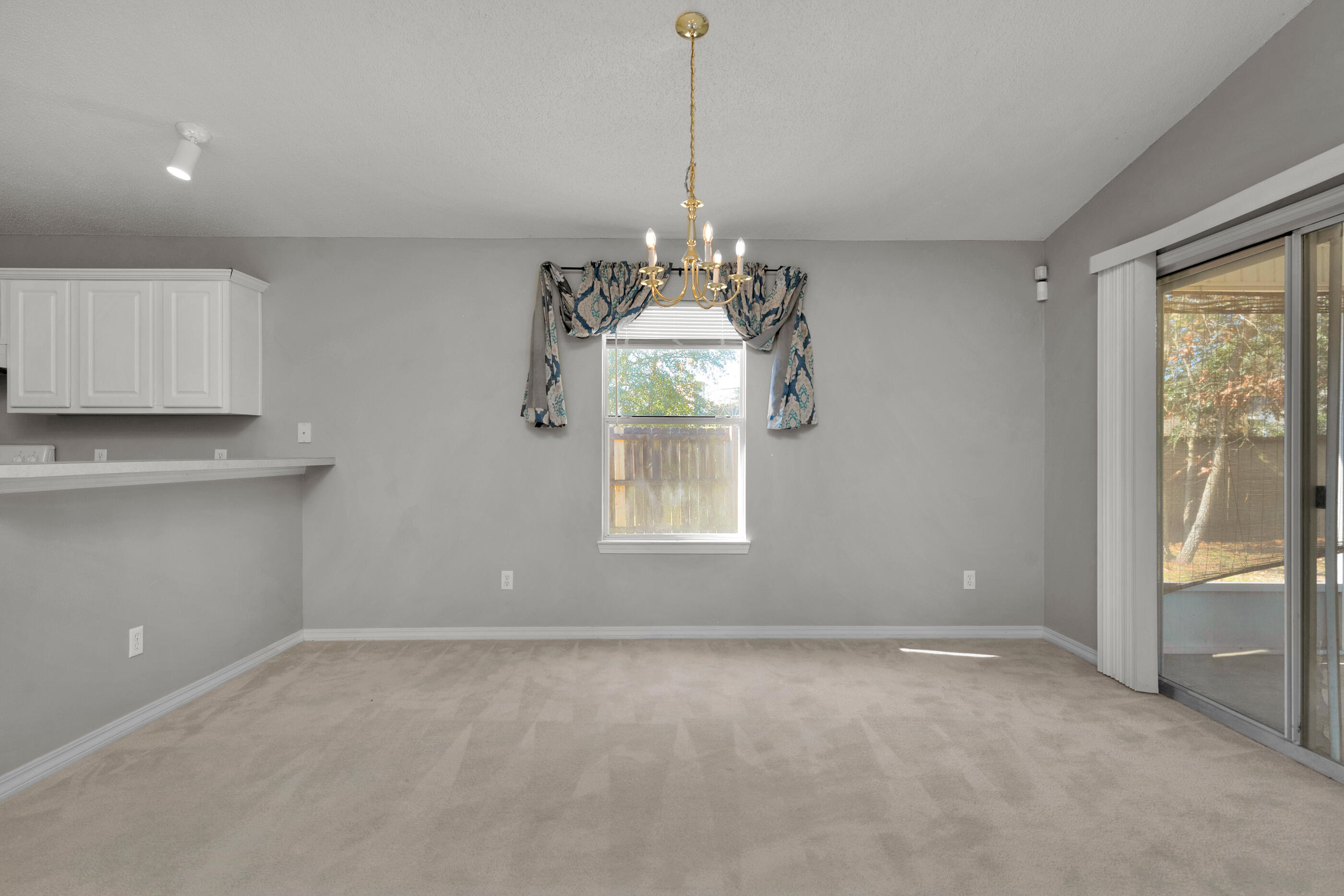 110 Sandstone Trail Crestview, FL 32539 - Photo 10 of 25 a view of an empty room with a window