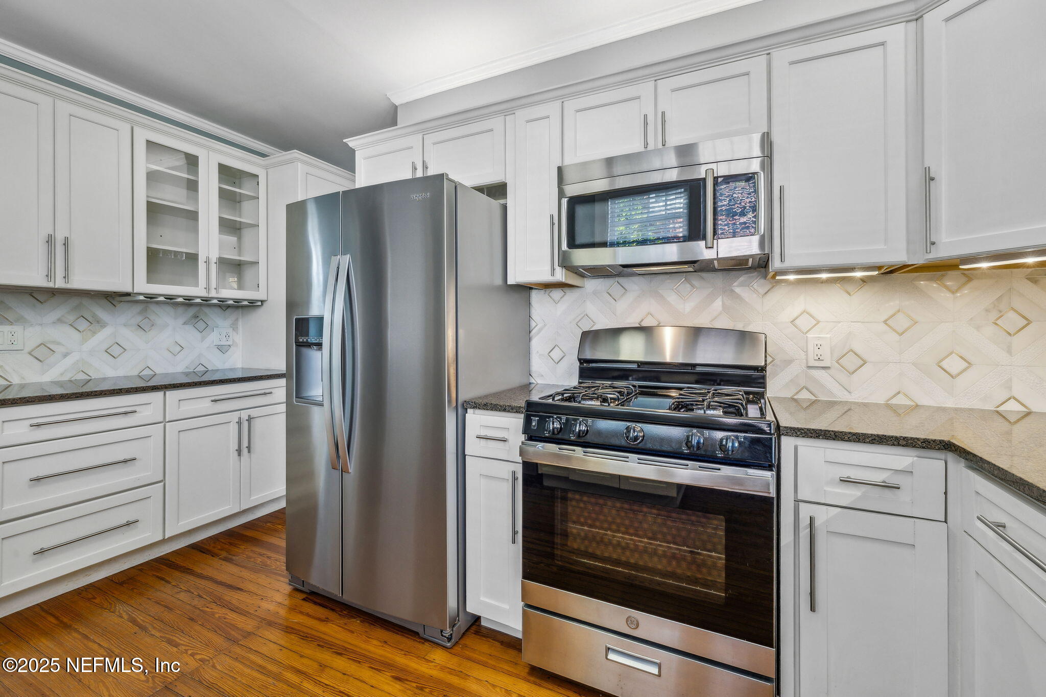 1361 Challen Avenue Jacksonville, FL 32205 - Photo 11 of 45 a kitchen with granite countertop white cabinets stainless steel appliances and wooden floor