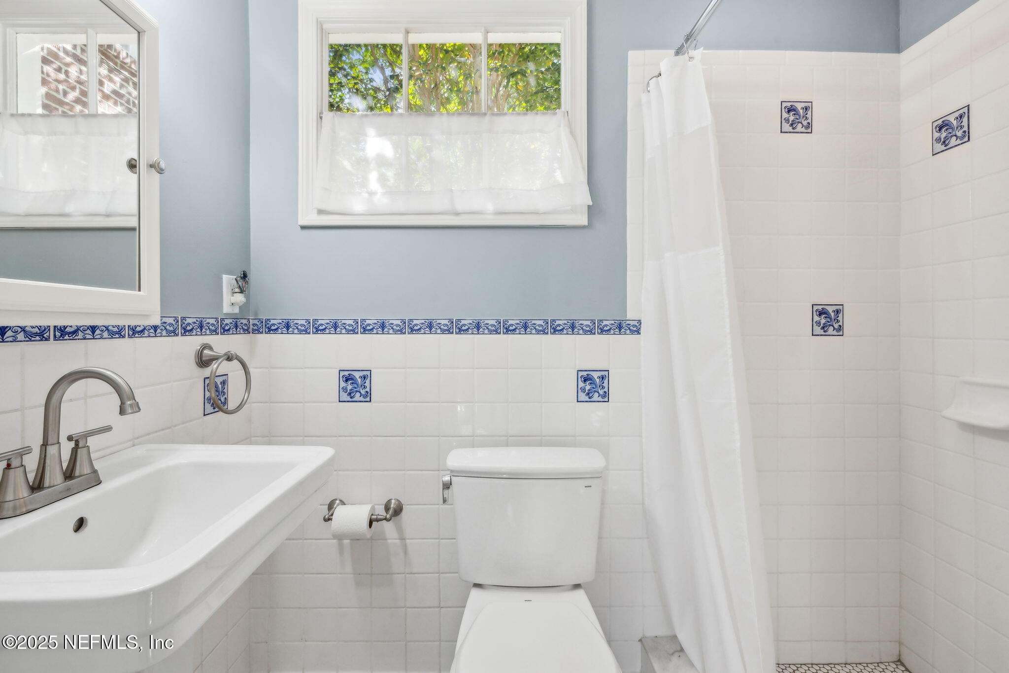 1361 Challen Avenue Jacksonville, FL 32205 - Photo 17 of 45 a bathroom with a sink a toilet and a window