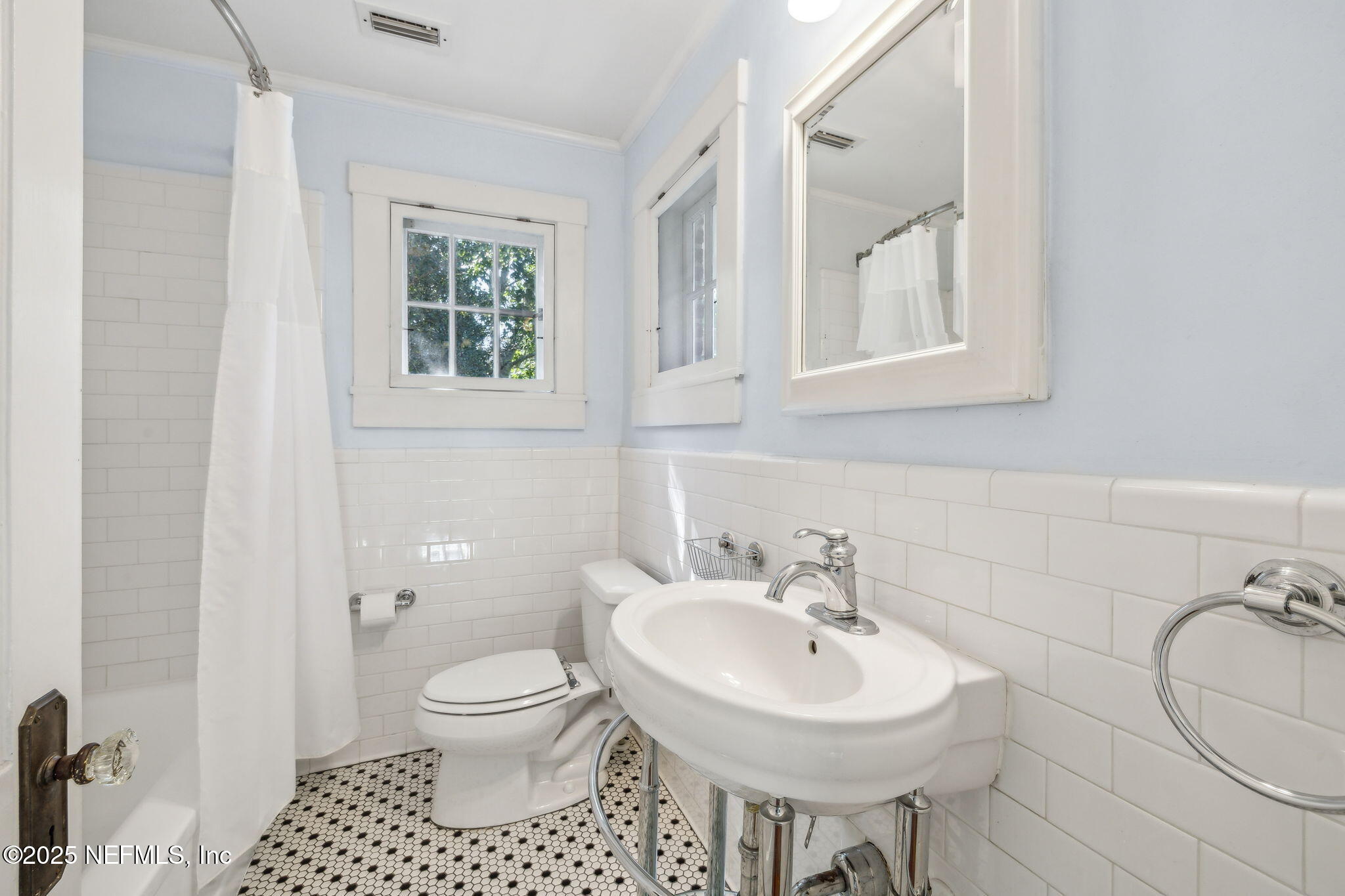 1361 Challen Avenue Jacksonville, FL 32205 - Photo 22 of 45 a bathroom with a sink a toilet and a mirror
