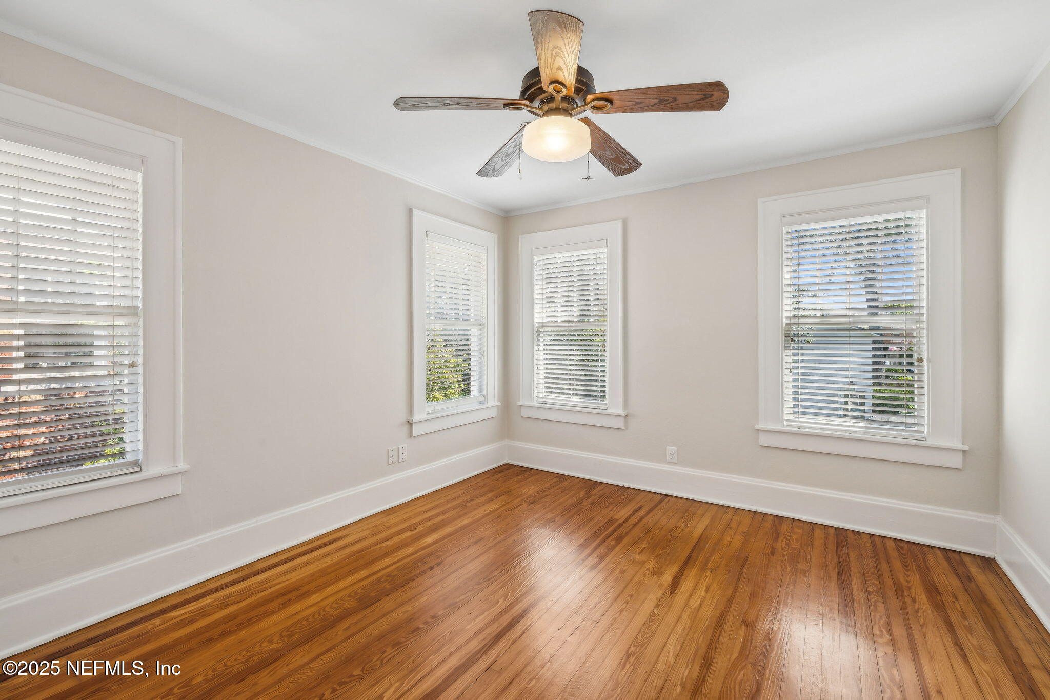 1361 Challen Avenue Jacksonville, FL 32205 - Photo 23 of 45 a view of an empty room with wooden floor and a window