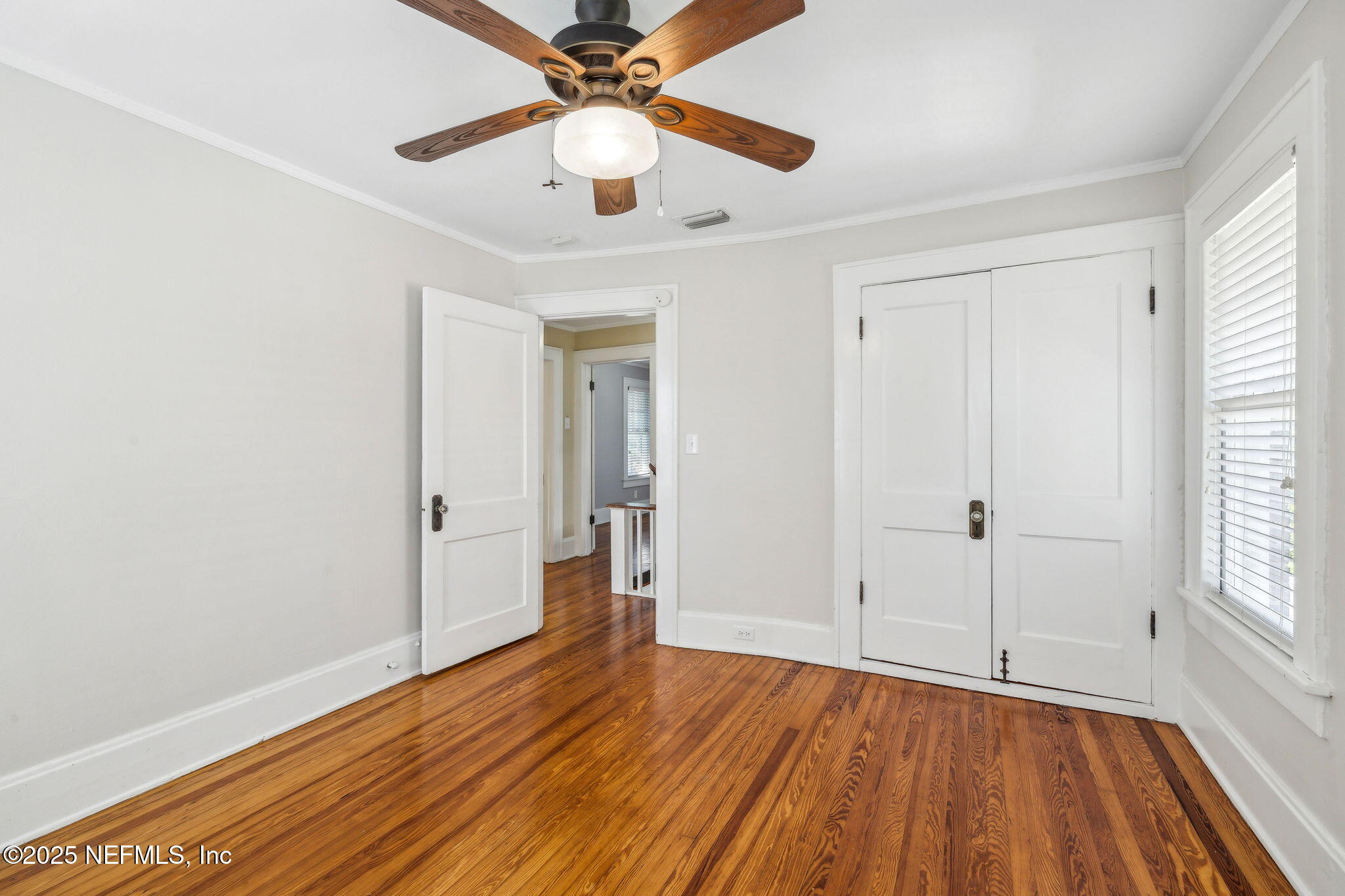 1361 Challen Avenue Jacksonville, FL 32205 - Photo 24 of 45 wooden floor in an empty room with a window