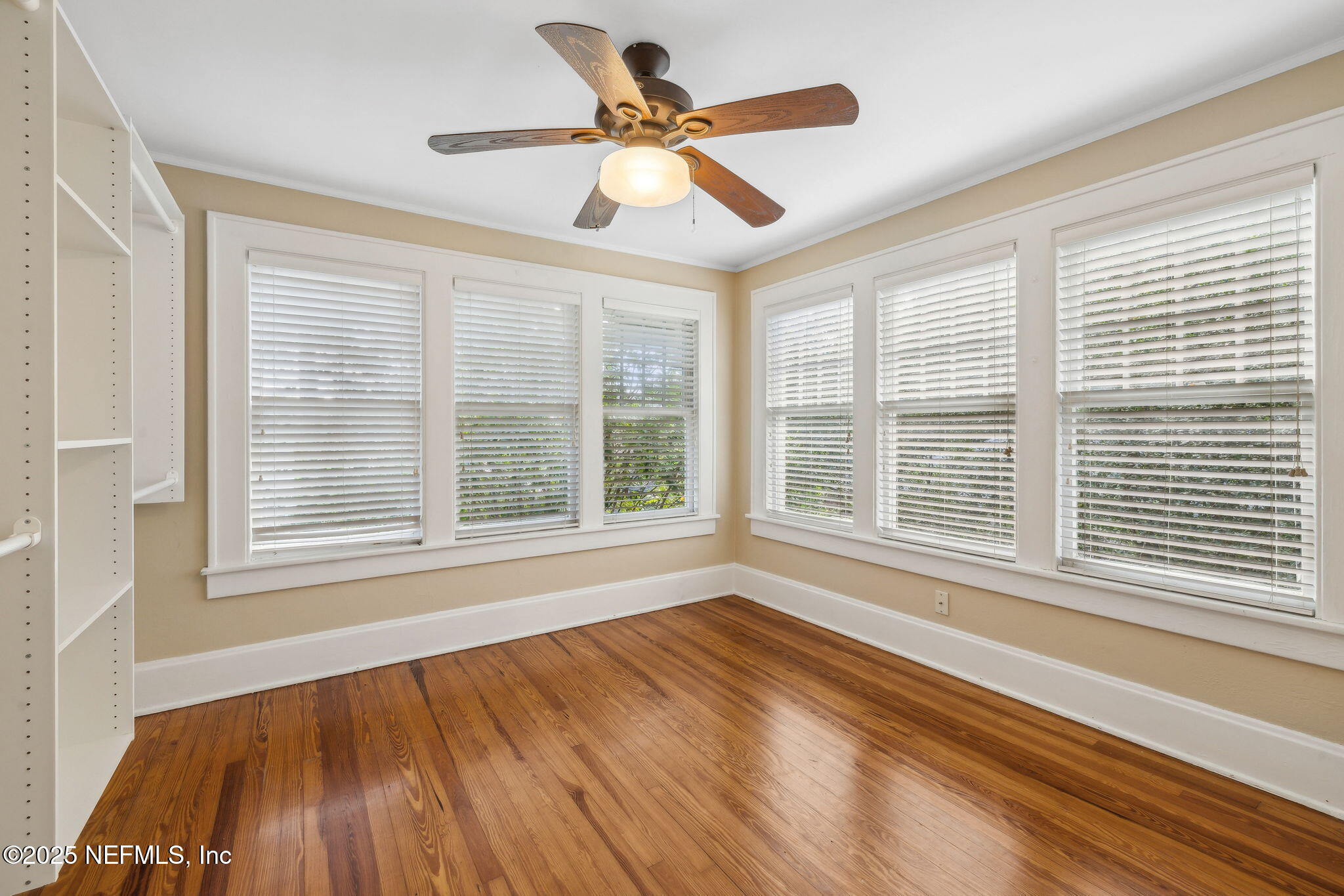 1361 Challen Avenue Jacksonville, FL 32205 - Photo 25 of 45 a view of an empty room with wooden floor and a window