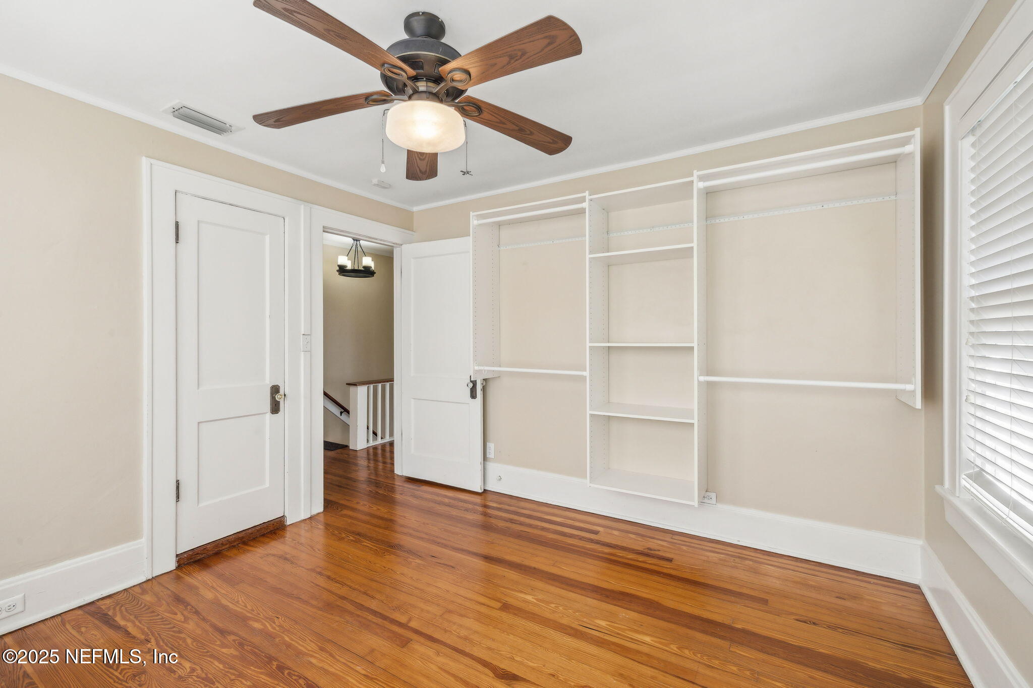 1361 Challen Avenue Jacksonville, FL 32205 - Photo 26 of 45 a view of an empty room with wooden floor and a window