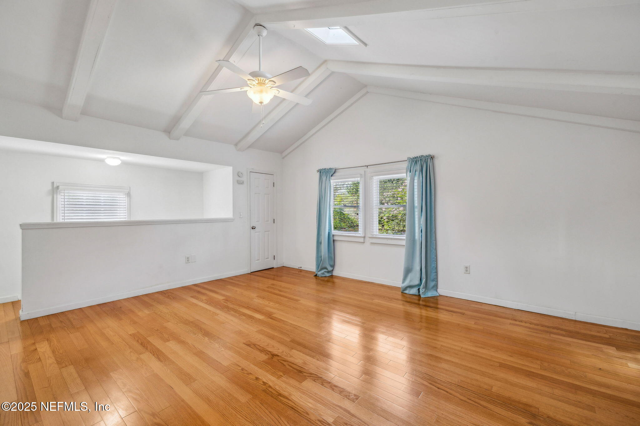 1361 Challen Avenue Jacksonville, FL 32205 - Photo 35 of 45 a view of an empty room with wooden floor and a window