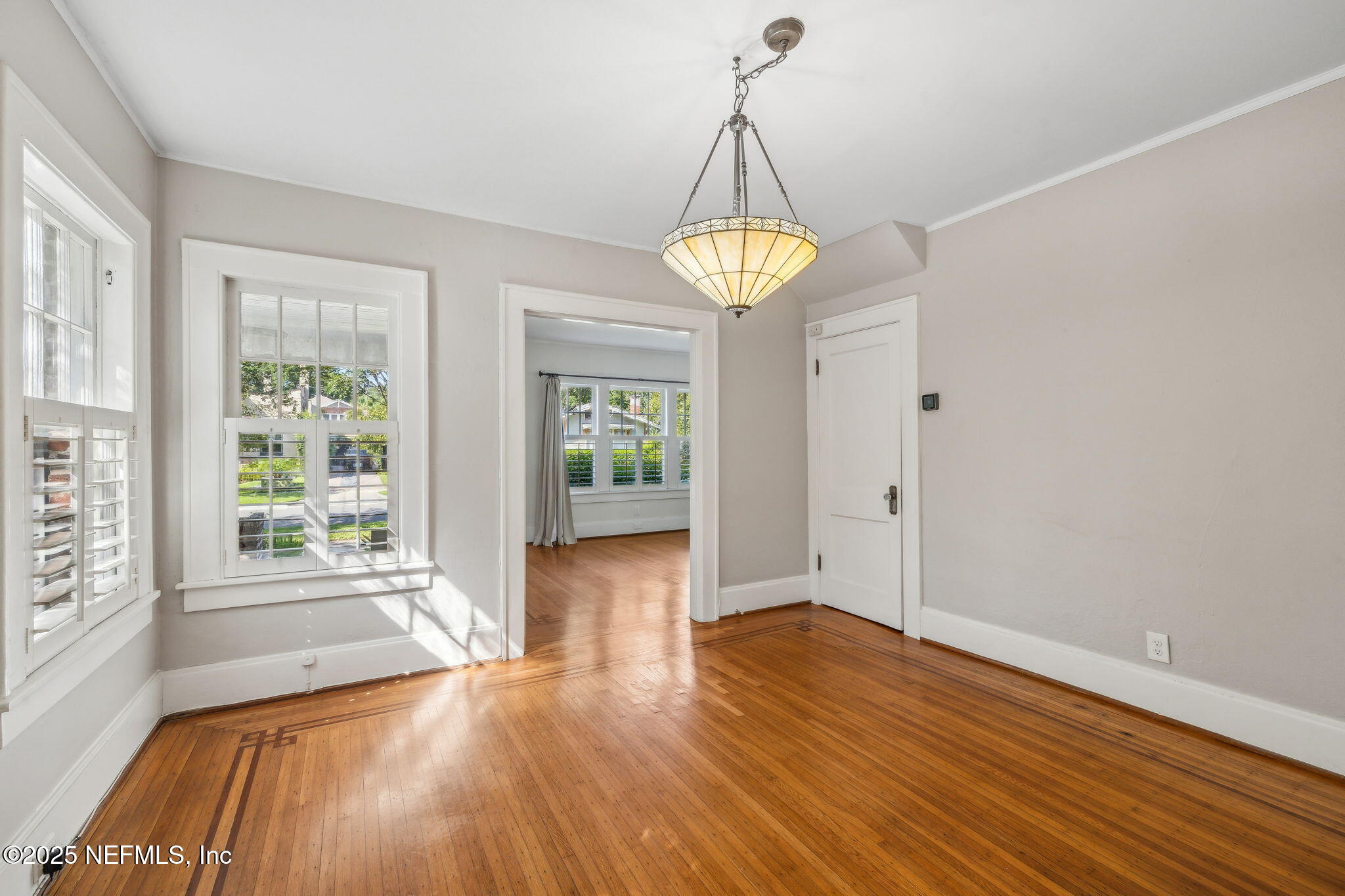 1361 Challen Avenue Jacksonville, FL 32205 - Photo 9 of 45 a view of empty room with wooden floor and chandelier