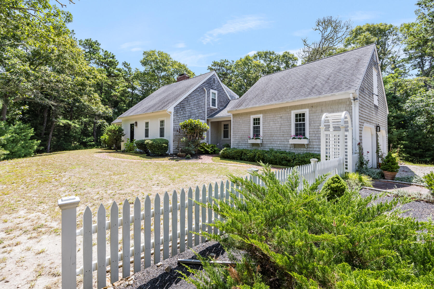 17 Cres Ridge Way Orleans, MA 02653 - Photo 1 of 40 a view of house with a yard and potted plants