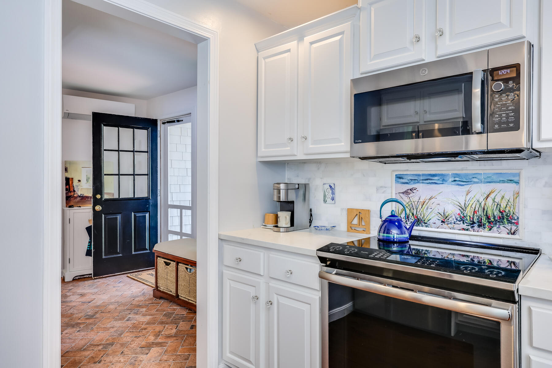 17 Cres Ridge Way Orleans, MA 02653 - Photo 11 of 40 a kitchen with stainless steel appliances a stove a microwave and cabinets