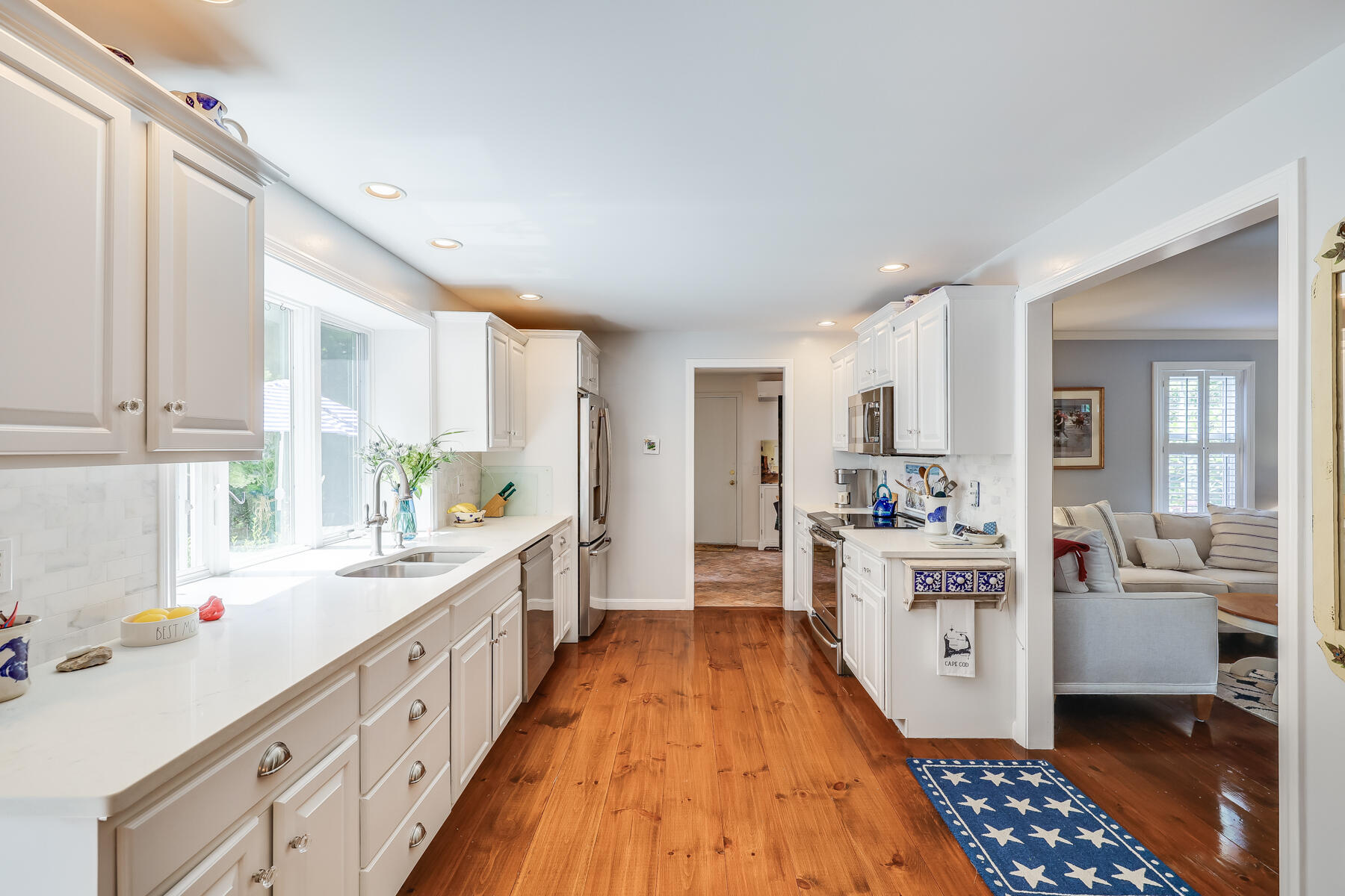 17 Cres Ridge Way Orleans, MA 02653 - Photo 13 of 40 a large kitchen with a lot of counter space and wooden floor