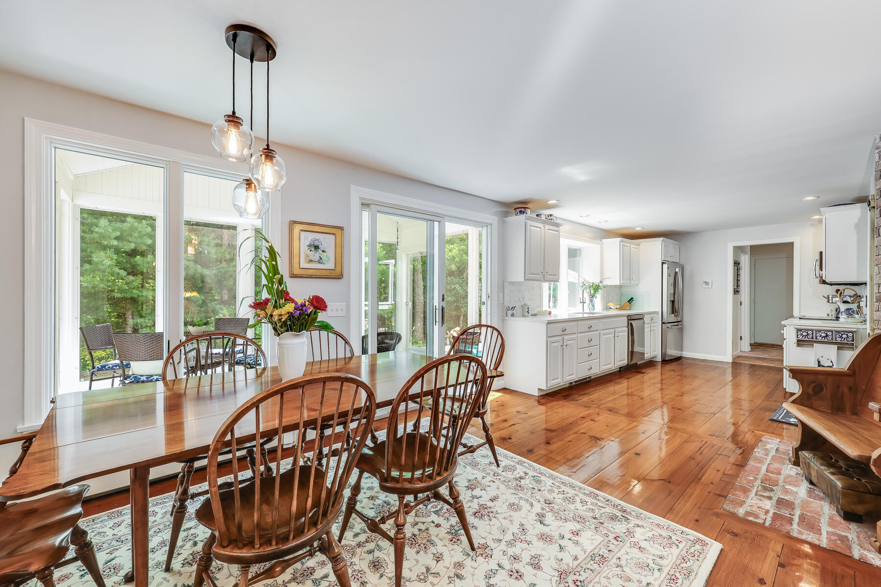 17 Cres Ridge Way Orleans, MA 02653 - Photo 14 of 40 a dining room with furniture a chandelier and wooden floor