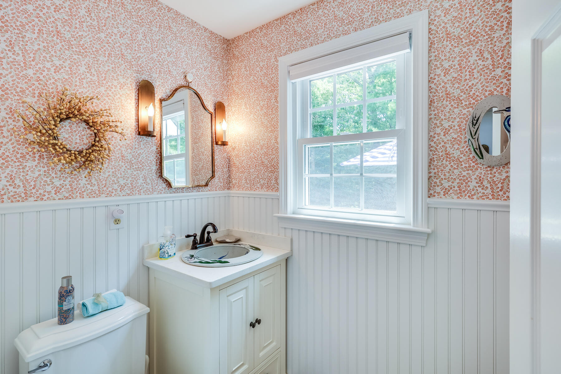 17 Cres Ridge Way Orleans, MA 02653 - Photo 18 of 40 a bathroom with a sink and a mirror