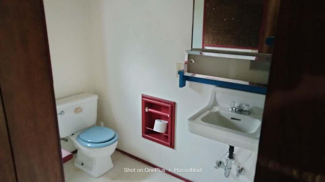 575 Kirkham Road Cave Junction, OR 97523 - Photo 43 of 45 a white toilet sitting next to a bathroom sink