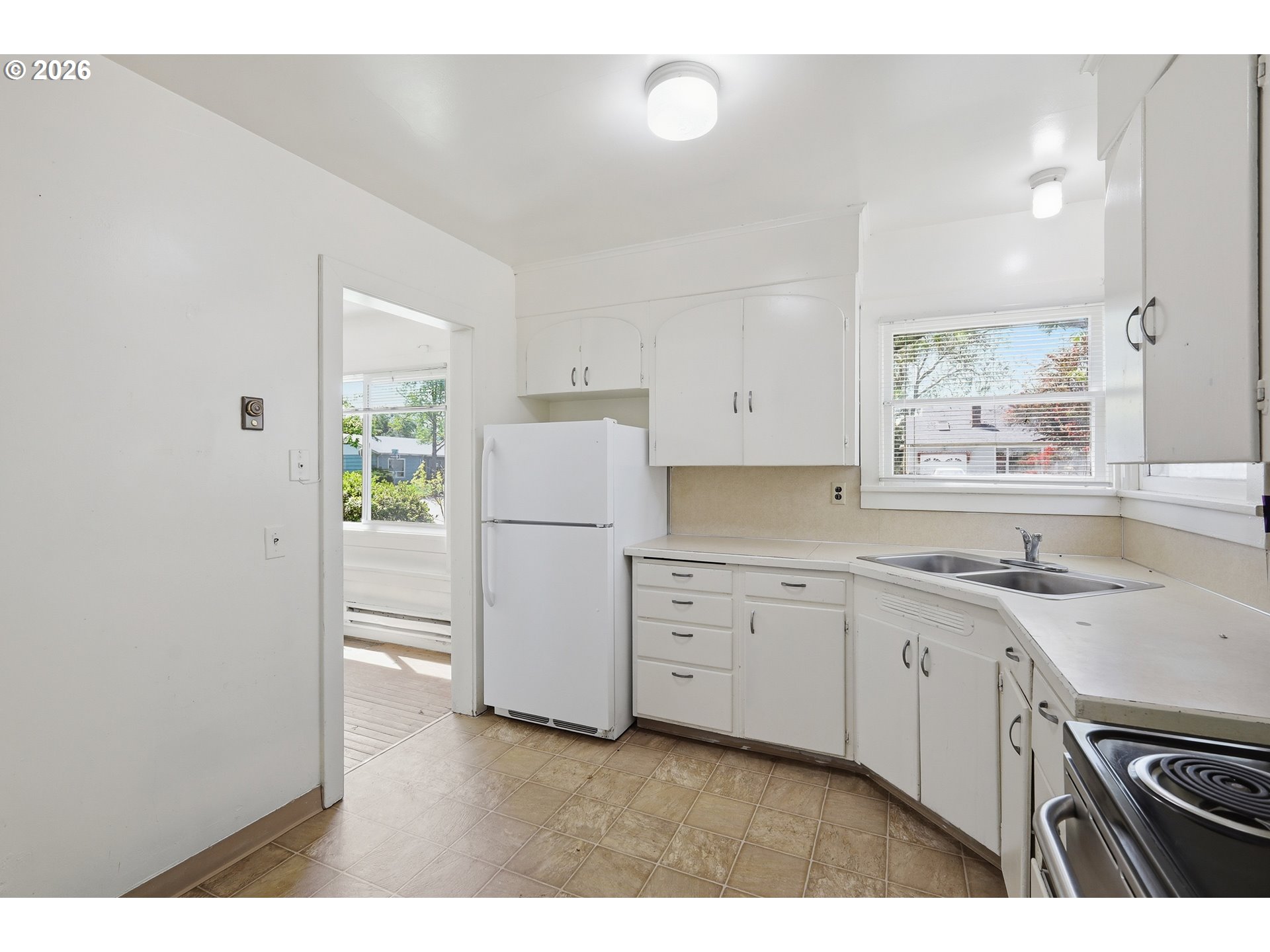2189 Hilyard Street Eugene, OR 97405 - Photo 11 of 39 a kitchen with sink refrigerator and stove