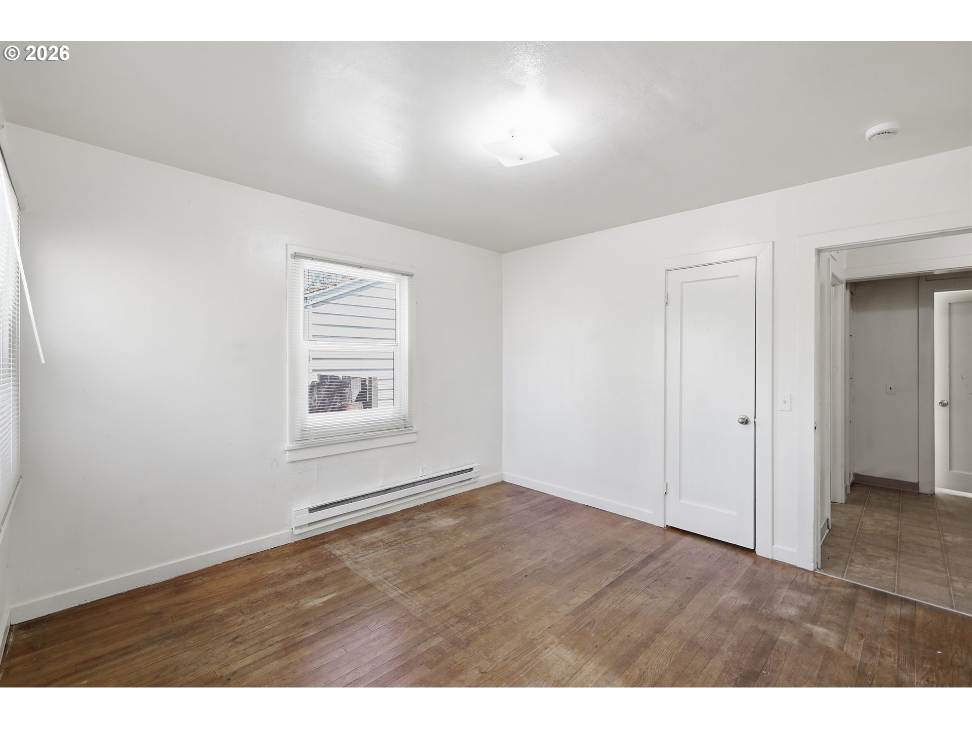 2189 Hilyard Street Eugene, OR 97405 - Photo 19 of 39 a view of an empty room with closet and a window