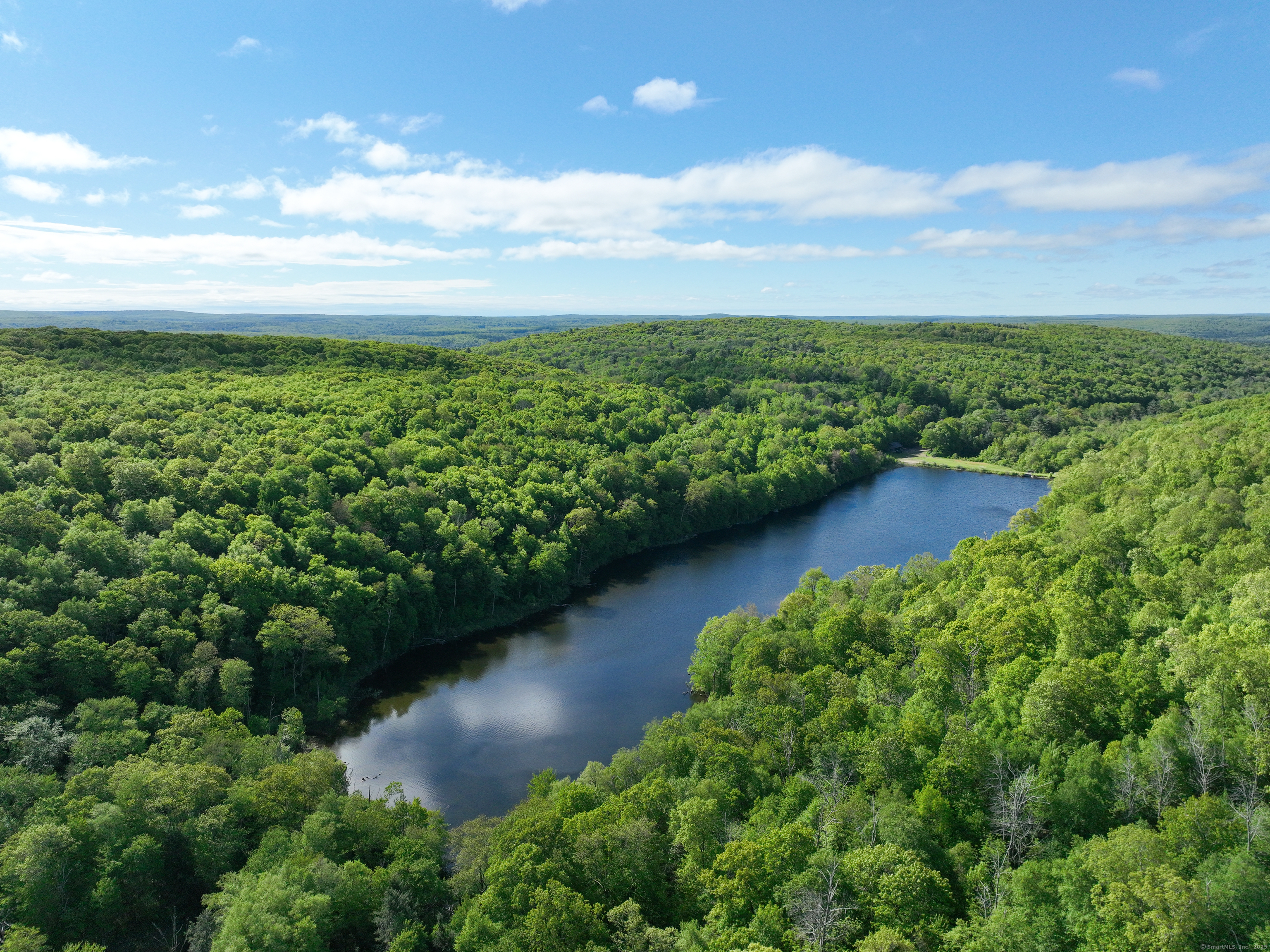 201 Diamond Ledge Road Stafford, CT 06076 - Photo 16 of 25 a view of a lake with a yard