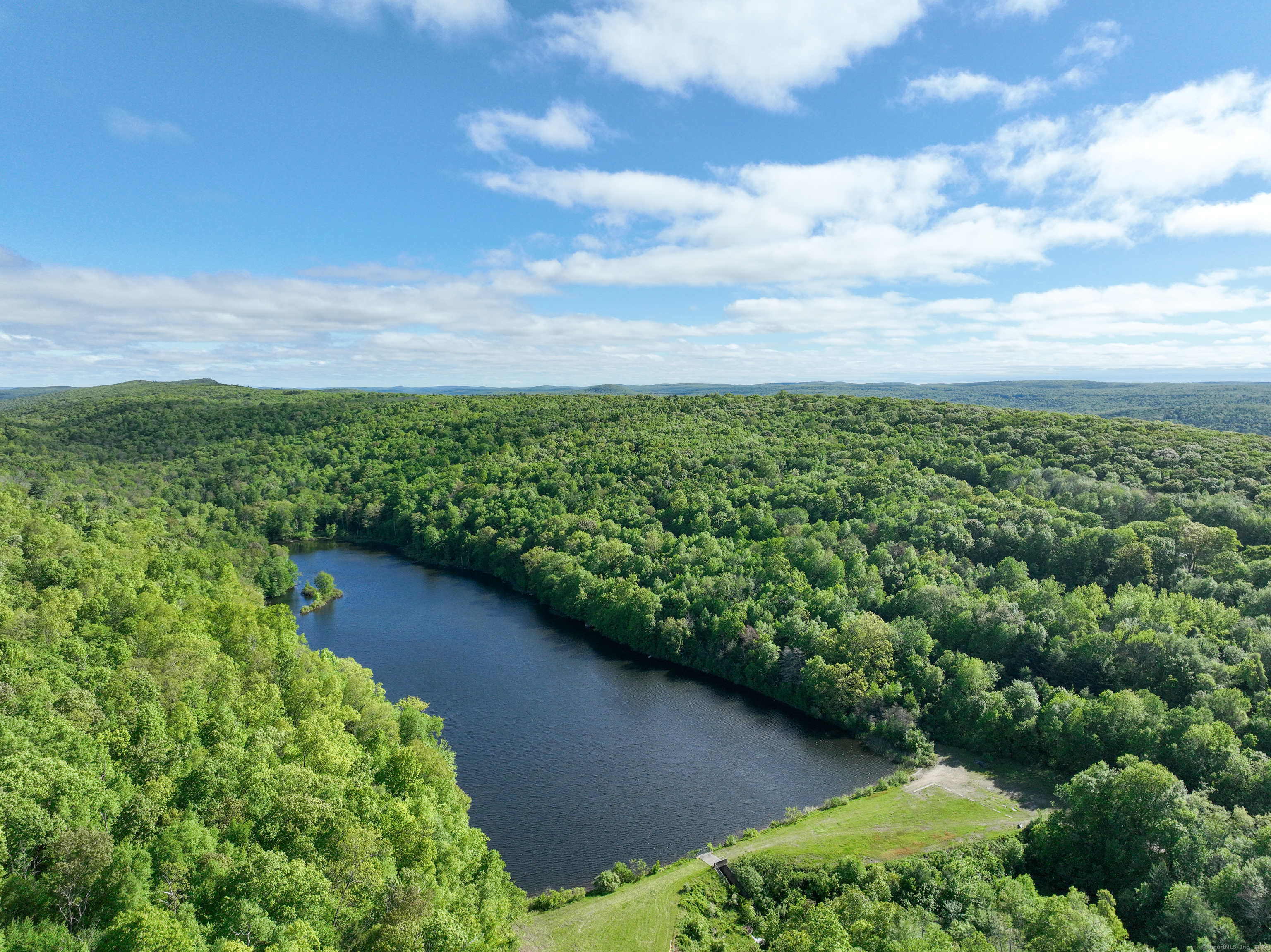 201 Diamond Ledge Road Stafford, CT 06076 - Photo 7 of 25 a view of a lake with a city