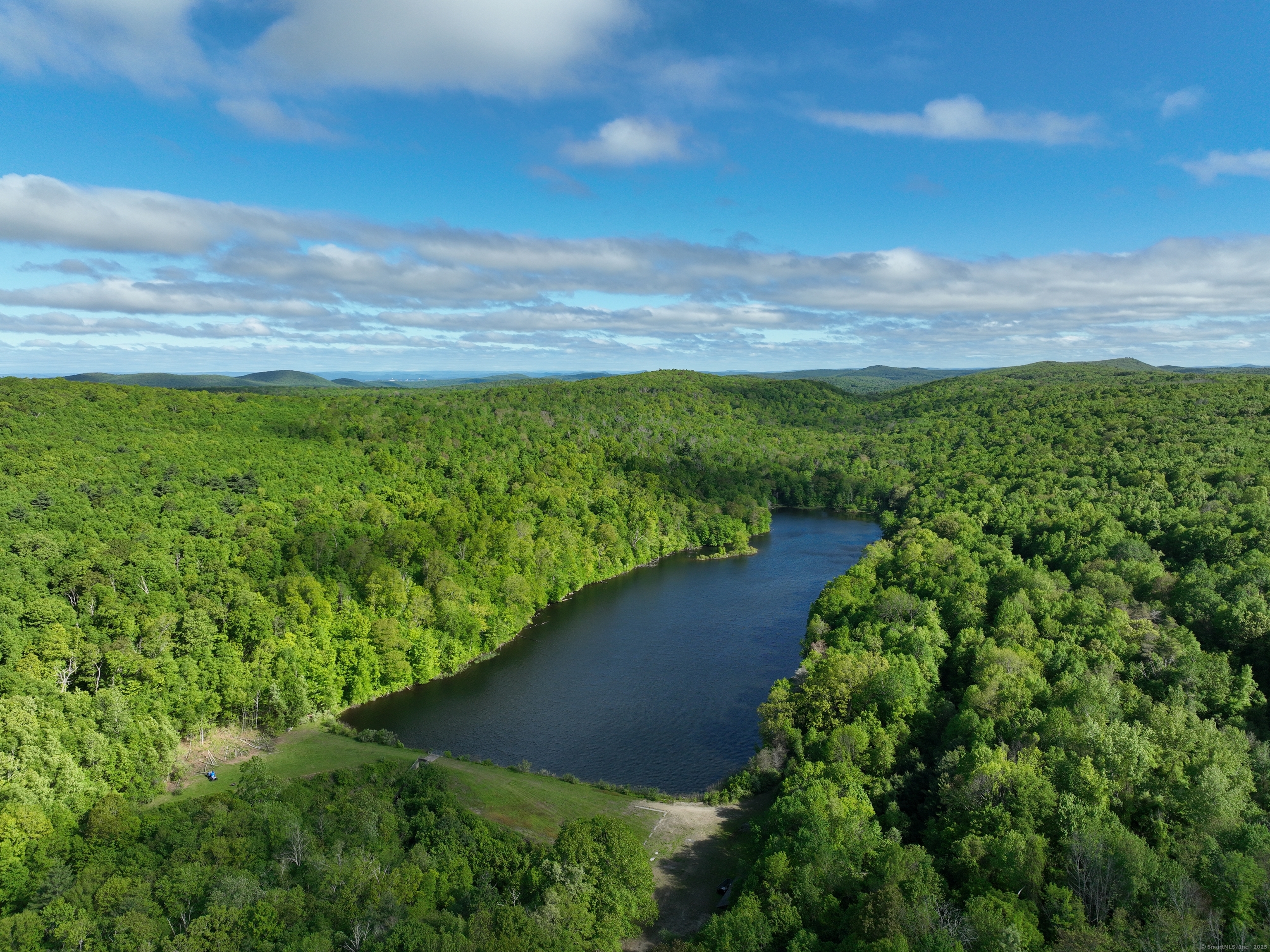 201 Diamond Ledge Road Stafford, CT 06076 - Photo 8 of 25 a view of a lake with a yard