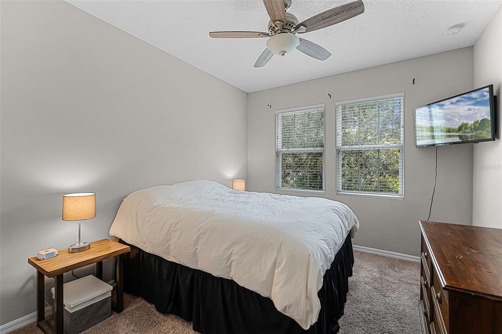 14242 Desert Haven Street, Unit GE Windermere, FL 34786 - Photo 18 of 32 a bedroom with a bed and a window