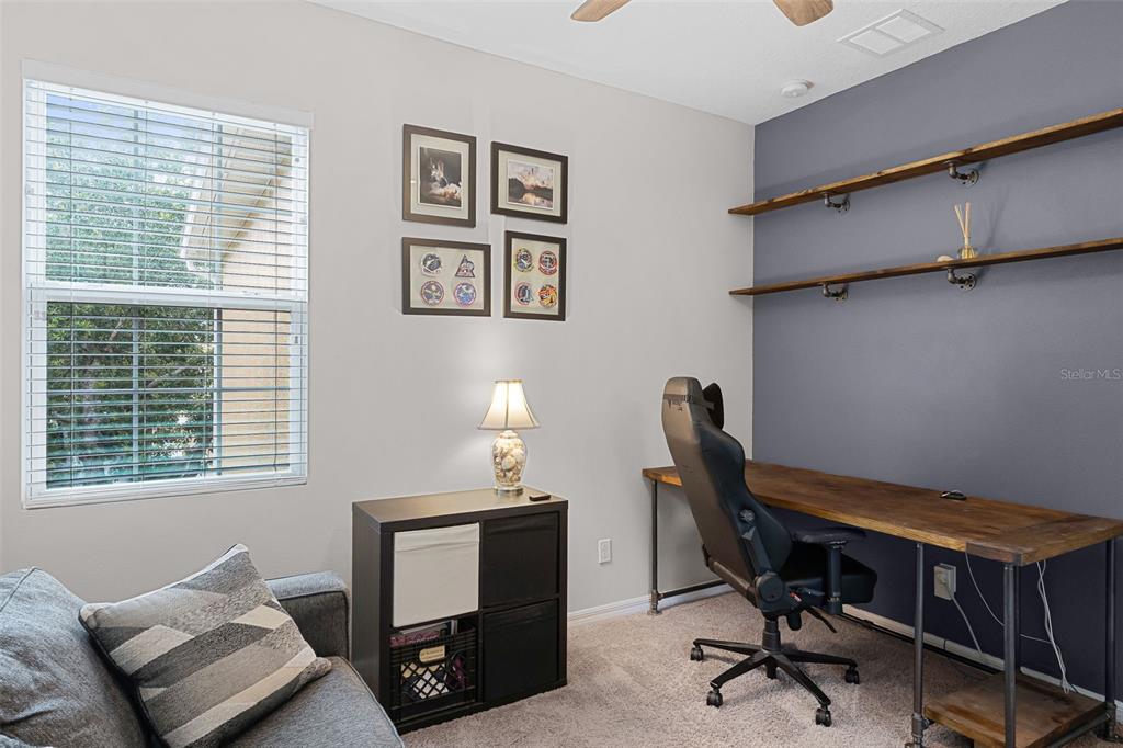 14242 Desert Haven Street, Unit GE Windermere, FL 34786 - Photo 21 of 32 a workspace with furniture and a window