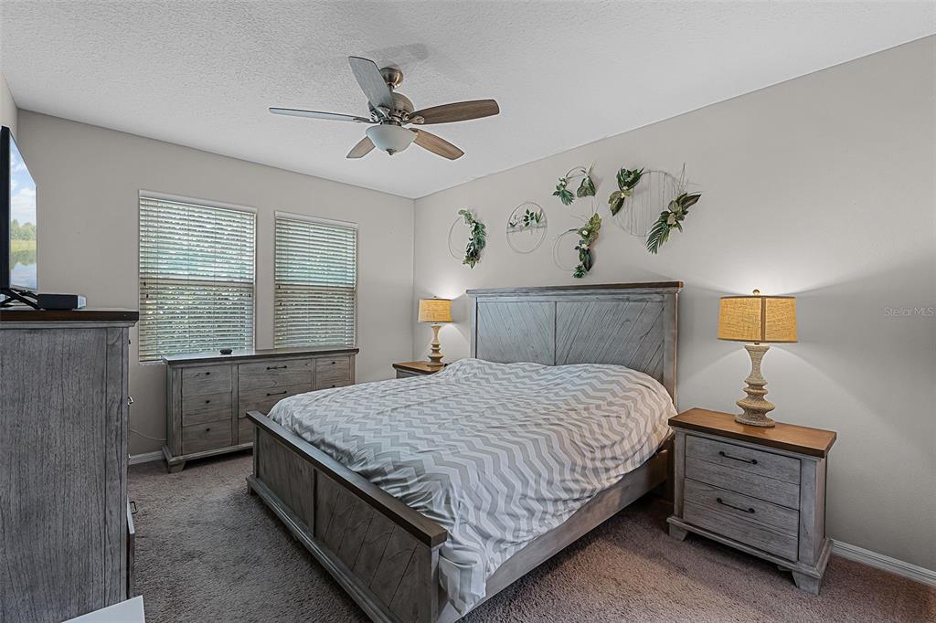 14242 Desert Haven Street, Unit GE Windermere, FL 34786 - Photo 24 of 32 a bedroom with a bed and window