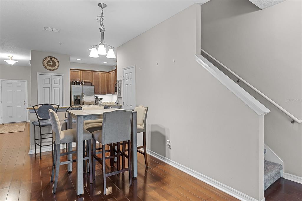 14242 Desert Haven Street, Unit GE Windermere, FL 34786 - Photo 5 of 32 a view of a dining room with furniture window and wooden floor