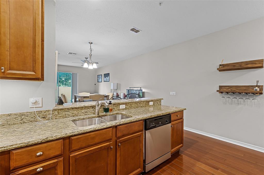 14242 Desert Haven Street, Unit GE Windermere, FL 34786 - Photo 10 of 32 a bathroom with a granite countertop sink and a mirror