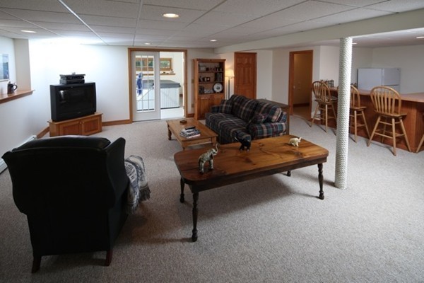 22 Ilex Road Marshfield, MA 02050 - Photo 16 of 21 a living room with furniture and a flat screen tv