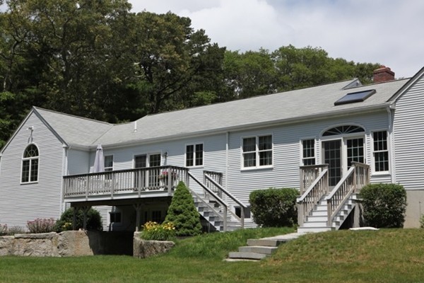22 Ilex Road Marshfield, MA 02050 - Photo 18 of 21 a front view of a house with a yard