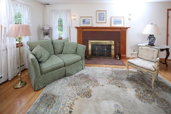 22 Ilex Road Marshfield, MA 02050 - Photo 2 of 21 a living room with furniture and a fireplace