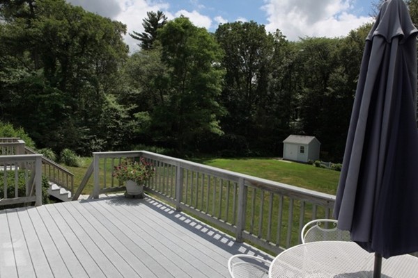 22 Ilex Road Marshfield, MA 02050 - Photo 7 of 21 a balcony with wooden floor table and chairs