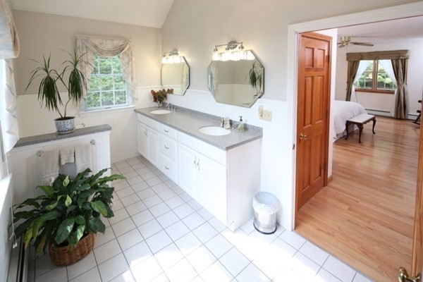 22 Ilex Road Marshfield, MA 02050 - Photo 9 of 21 a spacious bathroom with a granite countertop sink a mirror and vanity