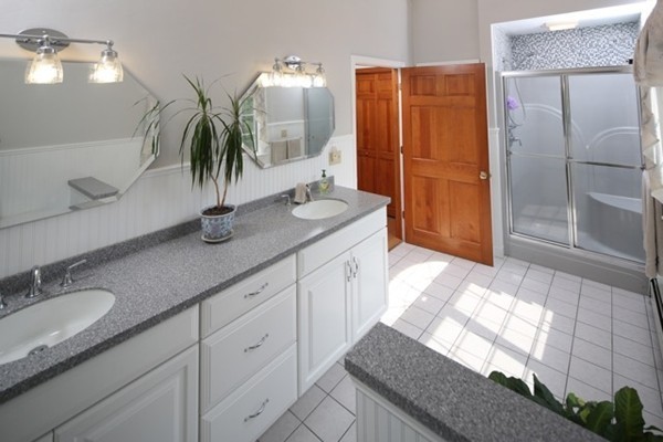 22 Ilex Road Marshfield, MA 02050 - Photo 10 of 21 a bathroom with a granite countertop sink and a mirror