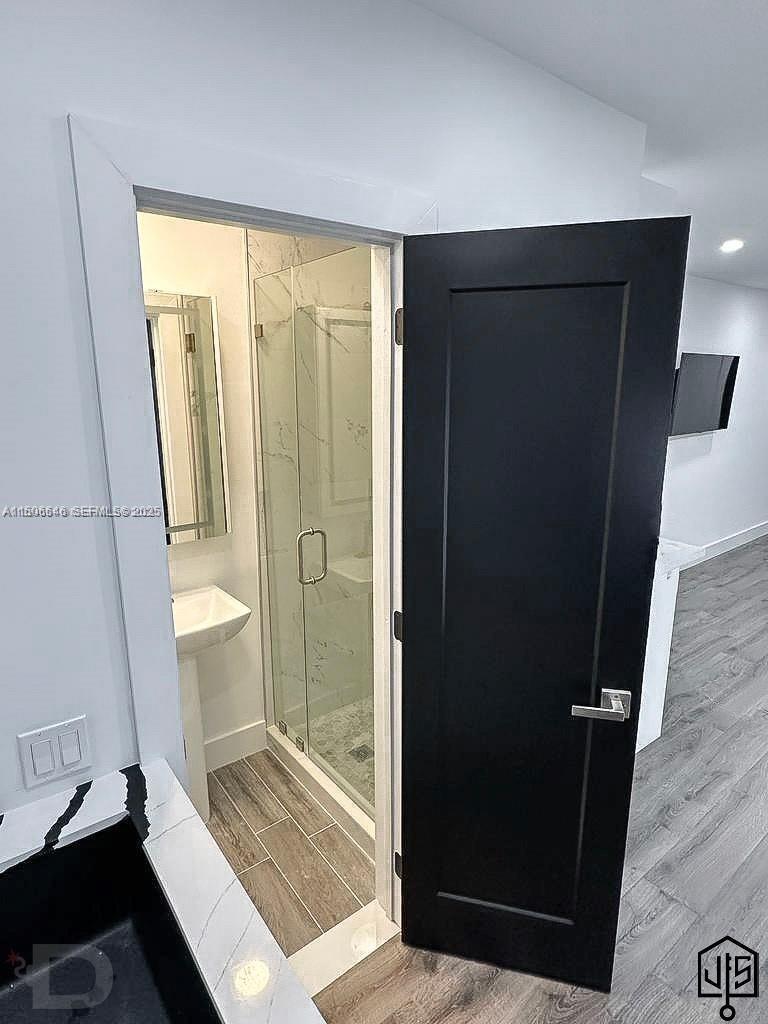 2100 Southwest 100th Avenue, Unit 1 Miami, FL 33165 - Photo 12 of 28 a bathroom with a glass door shower and a sink