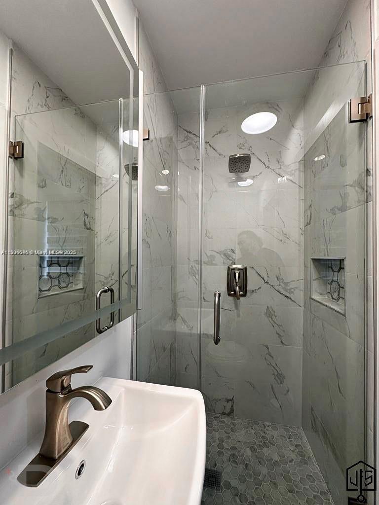 2100 Southwest 100th Avenue, Unit 1 Miami, FL 33165 - Photo 14 of 28 a bathroom with a sink a toilet and shower