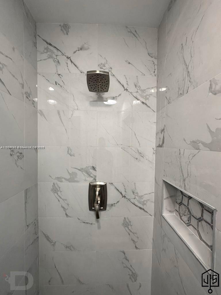 2100 Southwest 100th Avenue, Unit 1 Miami, FL 33165 - Photo 17 of 28 a bathroom with a bathtub