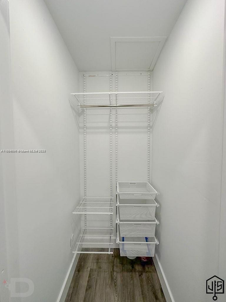 2100 Southwest 100th Avenue, Unit 1 Miami, FL 33165 - Photo 19 of 28 a view of walk in closet with empty racks
