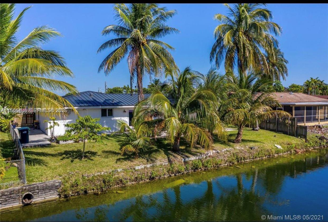 2100 Southwest 100th Avenue, Unit 1 Miami, FL 33165 - Photo 27 of 28 a view of backyard of house with outdoor seating