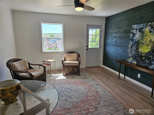a living room with furniture and a rug