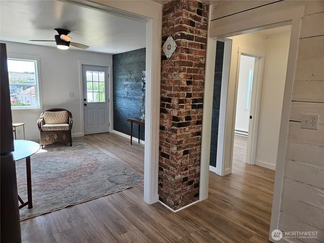 wooden floor in an empty room and a window