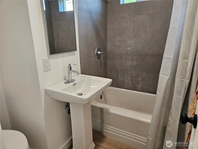 a bathroom with a sink and mirror