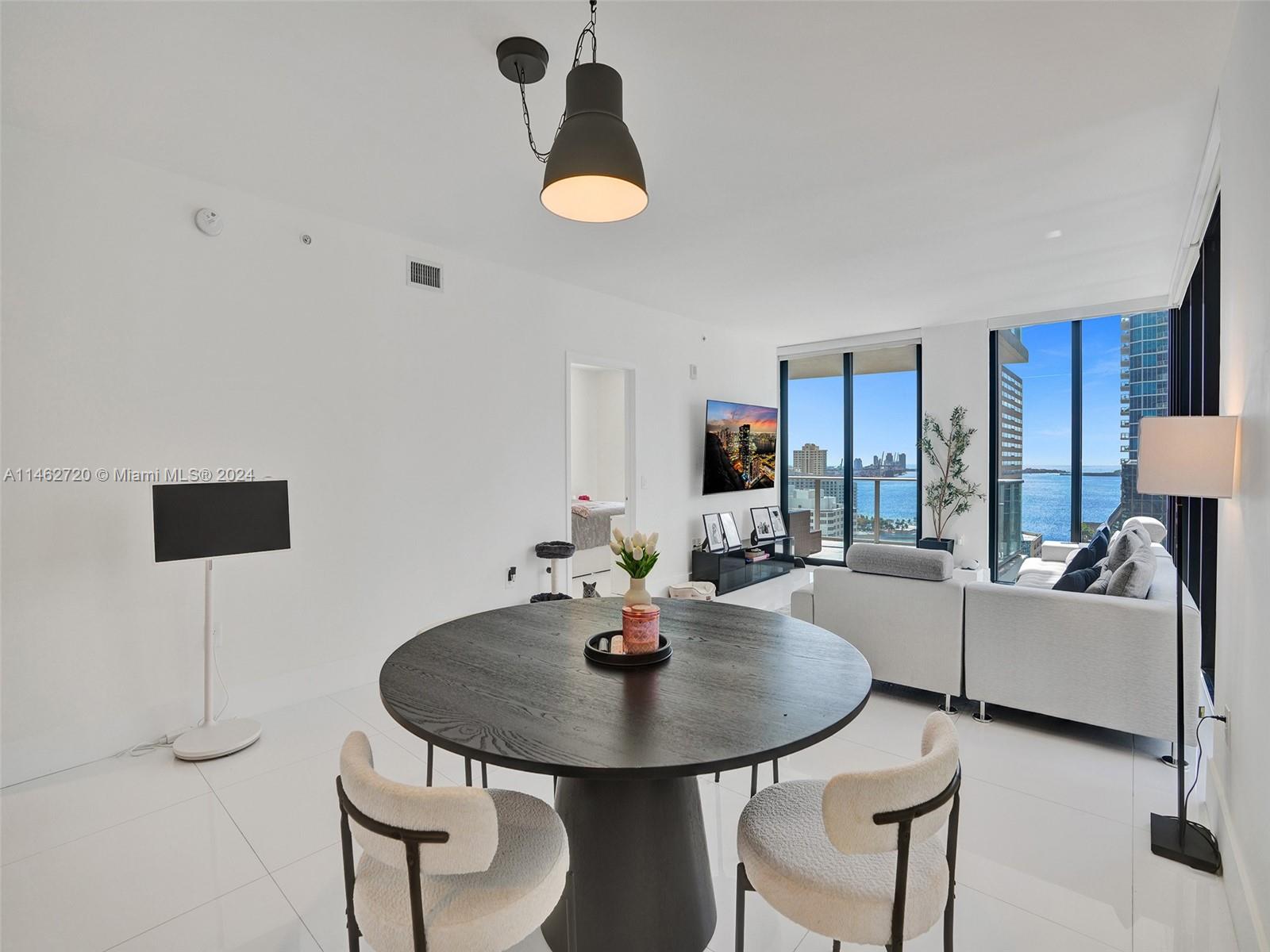 1010 Brickell Avenue, Unit 2505 Miami, FL 33131 - Photo 14 of 61 a living room with furniture and a table