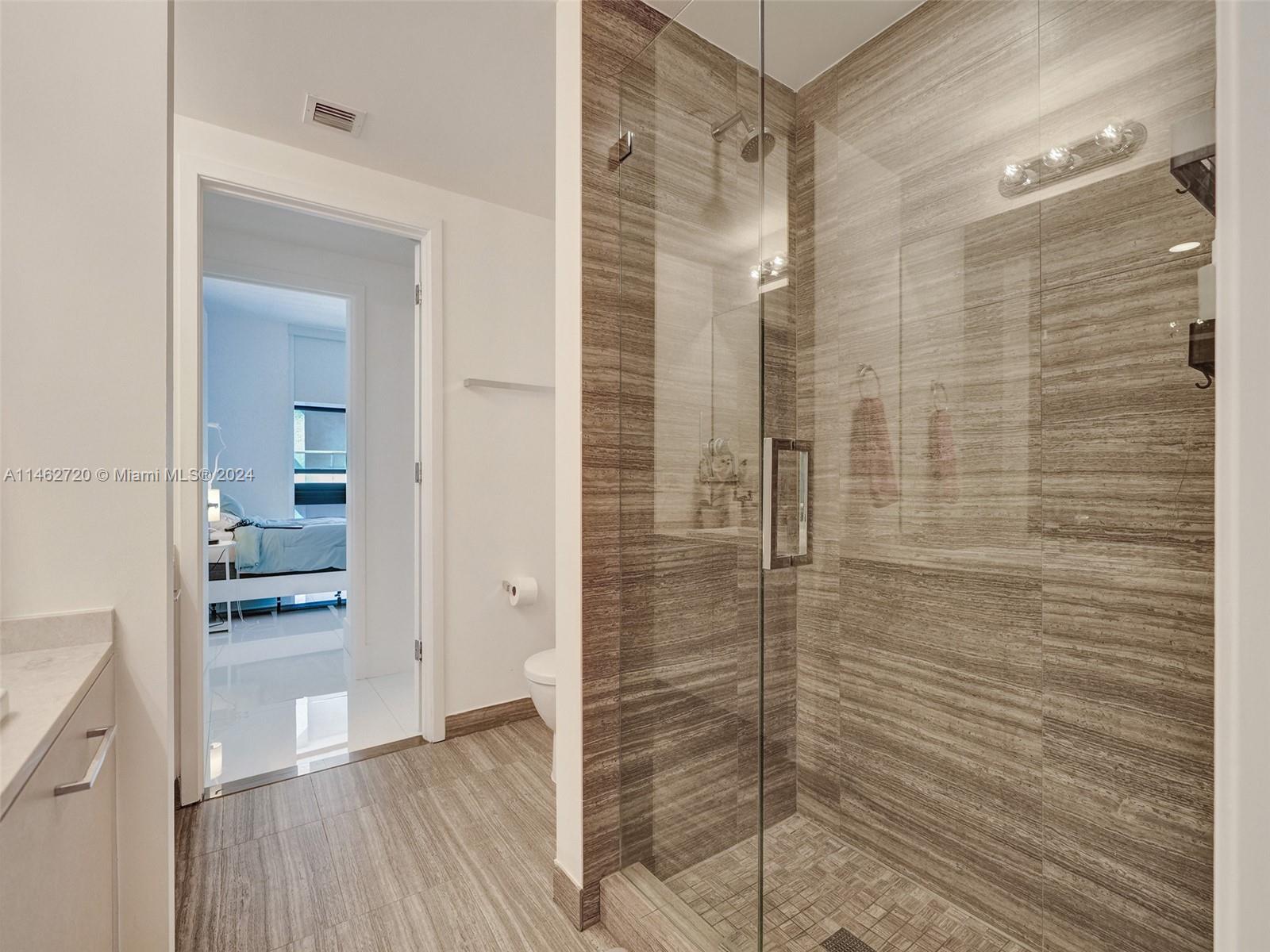 1010 Brickell Avenue, Unit 2505 Miami, FL 33131 - Photo 21 of 61 a bathroom with a shower