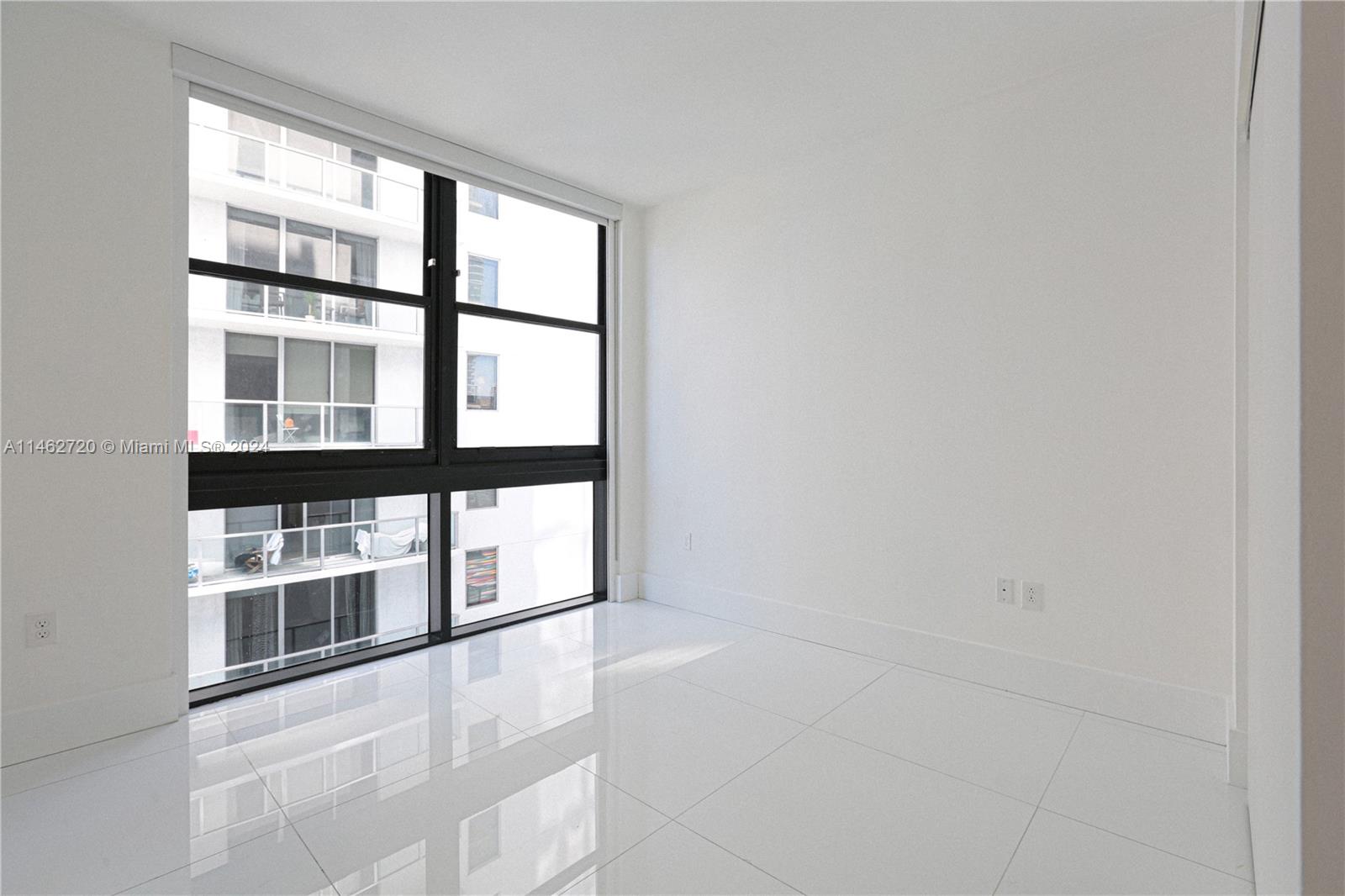 1010 Brickell Avenue, Unit 2505 Miami, FL 33131 - Photo 57 of 61 a view of an empty room with a window